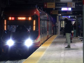 Passengers are seen at the Anderson LRT Station along the city's Red Line. Thursday, January 6, 2022.