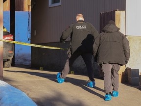 Police investigate at the scene of a suspicious death in the 6100 block of Thornaby Way N.W. on Sunday, January 16, 2022. A homeowner called police after they found the body of a man in their garage at about 2:30 p.m. Saturday afternoon.