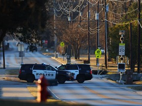 Police vehicles sit near Congregation Beth Israel Synagogue in Colleyville, Texas on January 16, 2022.