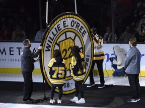 Former Bruins player Willie O’Ree has his number retired and raised to the rafters prior to a game against the Hurricanes at TD Garden in Boston, Tuesday, Jan. 18, 2022.