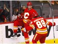 Calgary Flames forward Blake Coleman celebrates with Andrew Mangiapane after scoring against the Florida Panthers at Scotiabank Saddledome in Calgary on Tuesday, Jan. 18, 2022.