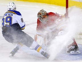 Calgary Flames goaltender Jacob Markstrom stops Pavel Buchnevich of the St. Louis Blues at the Scotiabank Saddledome in Calgary on Monday January 24, 2022.