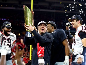 Head coach Kirby Smart celebrates after the Georgia Bulldogs beat the Alabama Crimson Tide in the College Football Playoff Championship game at Lucas Oil Stadium in Indianapolis on Monday, Jan. 10, 2022.