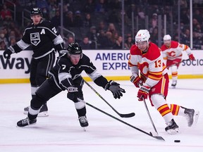 Calgary Flames left-winger Johnny Gaudreau (right) is defended by L.A. Kings defenceman Tobias Bjornfot in the first period at Staples Center.