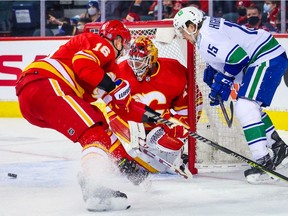Calgary Flames goaltender Jacob Markstrom guards his net against the Vancouver Canucks at Scotiabank Saddledome in Calgary on Saturday, Jan. 29, 2022.