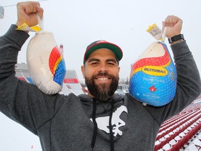 Calgary Stampeders defensive line coach Corey Mace poses for a photo during his annual turkey drive at McMahon Stadium on Dec. 13, 2019.