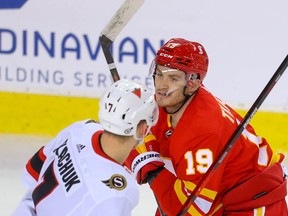 The Ottawa Senators' Brady Tkachuk battles his brother Matthew, of the Flames, in Calgary in this photo from March 7.