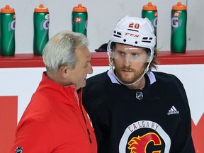 Calgary Flames head coach Darryl Sutter talks with Blake Coleman during a recent practice.
