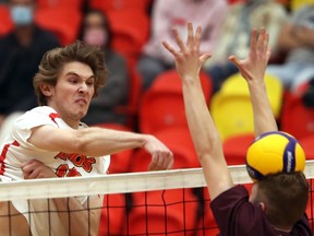 Calgary Dinos middle hitter Lincoln Baines goes on the attack.