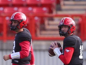Calgary Stampeders quarterbacks Jake Maier and Bo Levi Mitchell get some reps in during practice at McMahon Stadium in this photo from Sept. 28.