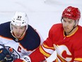 Flames forward Mikael Backlund keeps an eye on always-dangerous Edmonton Oilers captain Connor McDavid during action at the Scotiabank Saddledome in Calgary in this photo from April 10.