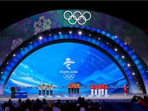 From left; Korea, Netherlands and China celebrate their medals in the women's 3000M long track relay team in a ceremony at the Beijing 2022 Winter Olympics on Monday, February 14, 2022. Gavin Young/Postmedia