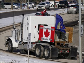 Protesters against pandemic restrictions drove their vehicles around the Alberta legislature, honking their horns, while the throne speech to commence the third session of Alberta's 30th legislature was presented on Tuesday, Feb. 22, 2022.