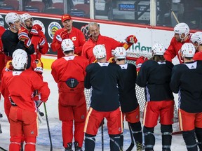 Calgary Flames head coach Darryl Sutter talks with the team during practice at Scotiabank Saddledome in Calgary on Dec. 29, 2021.