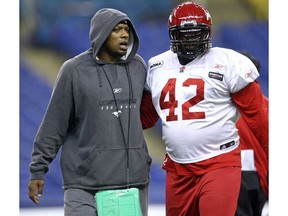 Calgary Stampeders defensive line coach Cornell Brown imparts his wisdom to lineman Mike Labinjo in advance of the 2008 Grey Cup in Montreal. The Stampeders defeated the Montreal Alouettes 22-14 to win the CFL title that year.