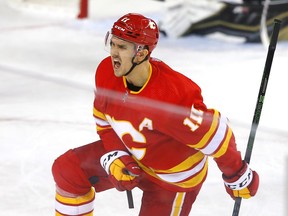 The Calgary Flames’ Mikael Backlund celebrates after scoring a goal against the Vegas Golden Knights at Scotiabank Saddledome in Calgary on Feb. 9, 2022.