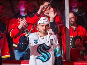 Seattle Kraken defenceman Mark Giordano acknowledges the crowd following a  video ceremony prior to the game against the Calgary Flames at Scotiabank Saddledome on Saturday night.