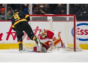 SNAPSHOTS: Stunning end for Flames' win streak - Toronto Sun 3 Canucks forward J.T. Miller scores on a penalty shot on Calgary Flames goalie Dan Vladar in the second period at Rogers Arena on Thursday night.