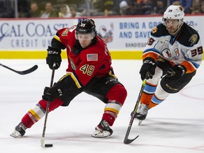 Calgary Flames forward prospect Jakob Pelletier, left, is averaging a point-per-game as a rookie in the American Hockey League.