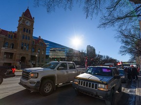Protesters shut down two lanes in front of Calgary city hall to rally against COVID restrictions and support the Coutts truckers convoy on Monday, Feb. 7, 2022.