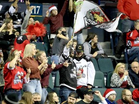 Calgary Roughnecks fans celebrate a goal against the San Diego Seals on WestJet Field at Scotiabank Saddledome on Friday, Dec. 17, 2021.