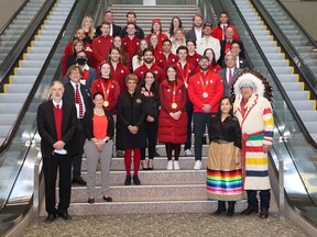 Calgary City Council poses in a group photo with Beijing 2022 Canadian Olympic and Paralympic athletes, coaches and staff following a ceremony at City Hall on Tuesday, March 29, 2022.