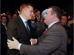 Brian Jean and Jason Kenney shake hands after Kenney's leadership victory on Oct. 28, 2017.