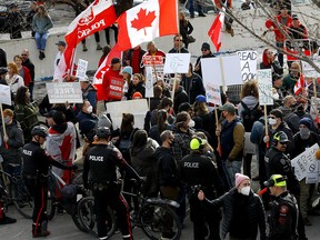 Counter-protesters and the weekly protesters clashed again on 17 Ave. and 5A St. S.W. resulting in police barricading the counter-protesters in Calgary on Saturday, March 12, 2022.