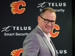 Calgary Flames general manager Brad Treliving smiles after speaking to media at the Scotiabank Saddledome on NHL trade deadline day, Monday, March 21, 2022.