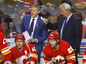 Calgary Flames assistant coach Cail MacLean behind the bench as the Flames played the Montreal Canadiens in NHL action at the Scotiabank Saddledome in Calgary on Thursday, March 3, 2022.