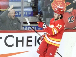 Johnny Gaudreau of the Calgary Flames celebrates after scoring his 200th NHL goal during the second period of action as the Calgary Flames host the visiting Arizona Coyotes at the Saddledome. March 25, 2022. Brendan Miller/Postmedia