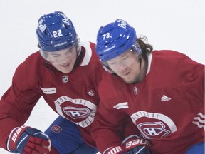 Then-Montreal Canadiens teammates Cole Caufield and Tyler Toffoli battle for the puck during practice in this photo from June 27, 2021.