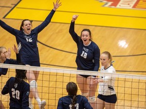 The Mount Royal University Cougars react during their national women’s volleyball semifinal against the University of Alberta Pandas at the University of Calgary’s Jack Simpson Gym on Saturday, March 26, 2022.