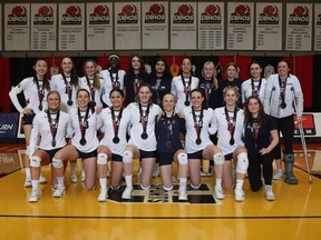 The Mount Royal University Cougars celebrate their silver-medal performance at the U Sports Women’s Volleyball Championship at the University of Calgary’s Jack Simpson Gym on Sunday, March 27, 2022.