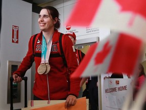 Canadian para skier Olympian Alana Ramsay smiles as she is welcomed home at the Calgary International Airport on Monday March 19, 2018. Ramsay was a double bronze medallist at the 2018 Paralympics.