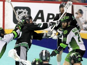 The Calgary Roughnecks’ Tyler Pace fires a shot through traffic against the Saskatchewan Rush on WestJet Field at Scotiabank Saddledome on Thursday, March 17, 2022.