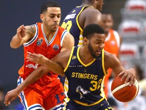 The Edmonton Stingers’ Stuckey Mosley battles the Cangrejeros’ Angel Rodriguez during their Basketball Champions League Americas game at WinSport’s Markin MacPhail Centre in Calgary on Monday, March 14, 2022.