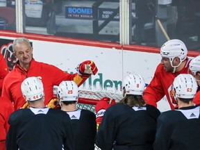 Calgary Flames head coach Darryl Sutter talks with the team during a recent practice at the Scotiabank Saddledome.