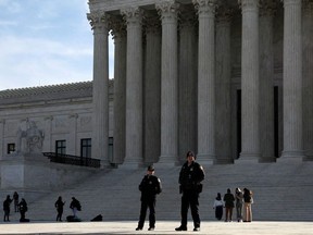 U.S. police officers stand in front of the U.S. Supreme Court building in Washington, U.S. March 15, 2022.
