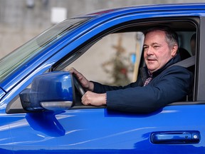 Premier Jason Kenney leaves in his truck after a press conference at a Co-Op gas station on Macleod Trail S.E. on Friday, April 1, 2022.