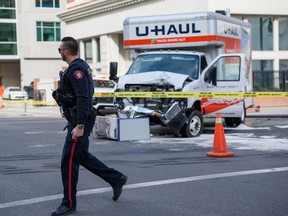 Calgary first responders are present at the scene of a hit and run on 12 Ave. and 1 St. S.W. on Tuesday, April 5, 2022.