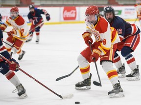 The Calgary Flames’ Keenan Ingram moves with the puck against Yale Hockey Academy during the Mac’s International Hockey Tournament action at Father David Bauer Arena in Calgary on Thursday, April 7, 2022.