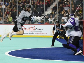 The Calgary Roughnecks’ Curtis Dickson zooms in for a shot on Panther City Lacrosse Club goalie Nick Damude on WestJet Field at Scotiabank Saddledome on Saturday, April 9, 2022.