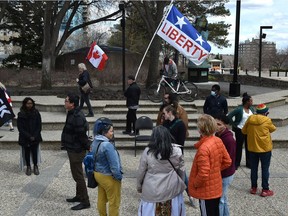 A group of anti-COVID restriction demonstrators marched through a group of Bill 204 supporters outside the Alberta Legislature on April 30, 2022. Bill 204 would require the government to collect race-based data aimed at spotting disparities in the provision of government services.