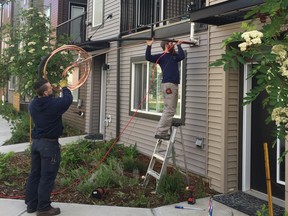 The Furnace Family team busy at work installing local air conditioning systems. SUPPLIED