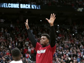 Miami Heat guard Kyle Lowry acknowledges the crowd prior to facing his former team, the Raptors, in Toronto on Sunday, April 3, 2022.