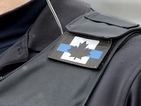 Calgary police officers are still wearing the thin blue line patch despite controversy. Photo taken in Calgary on Thursday, April 14, 2022.