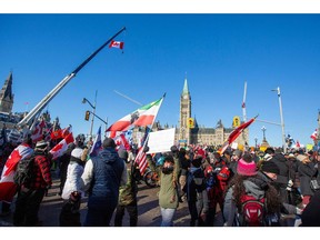Supporters take part in a convoy to protest COVID-19 vaccine mandates for cross-border truck drivers in Ottawa, Jan. 29, 2022.