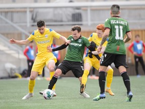 Cavalry FC (in green) battles Atletico Ottawa at TD Place Stadium in Ottawa on Saturday, April 9, 2022.