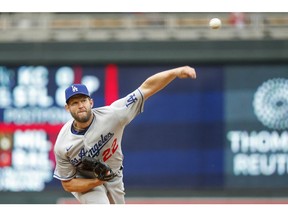 Apr 13, 2022; Minneapolis, Minnesota, USA; Los Angeles Dodgers starting pitcher Clayton Kershaw (22) throws to the Minnesota Twins in the sixth inning at Target Field. Mandatory Credit: Bruce Kluckhohn-USA TODAY Sports